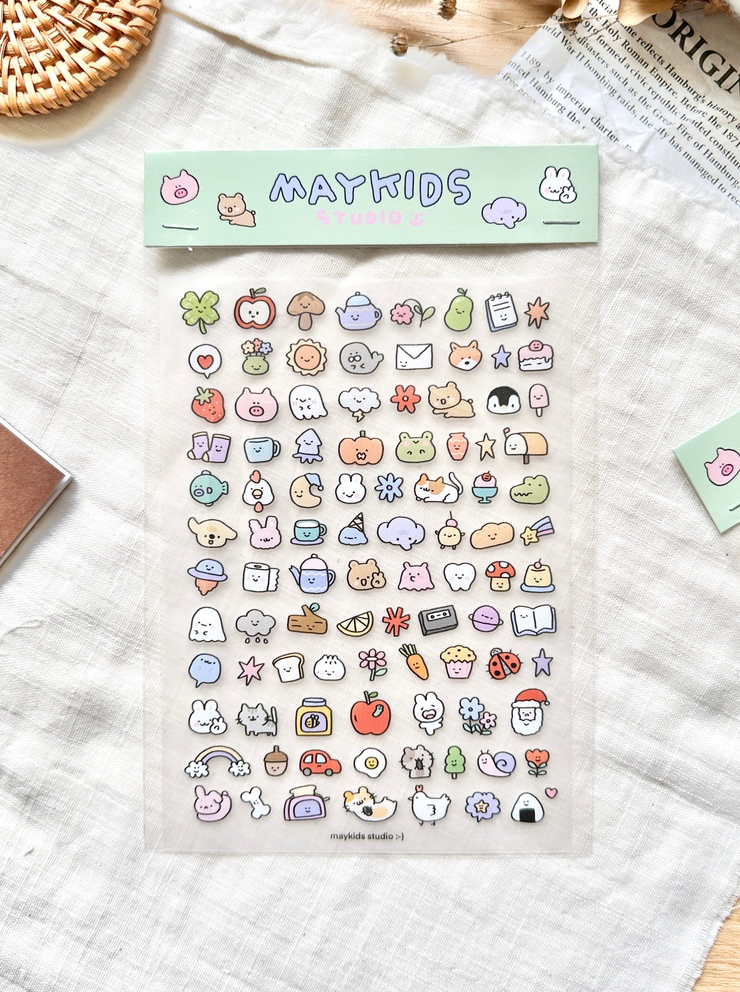 Sheet of colorful stickers with 'MAYKIDS' branding on a textured surface, cute, stickers, hope and letters, nz,