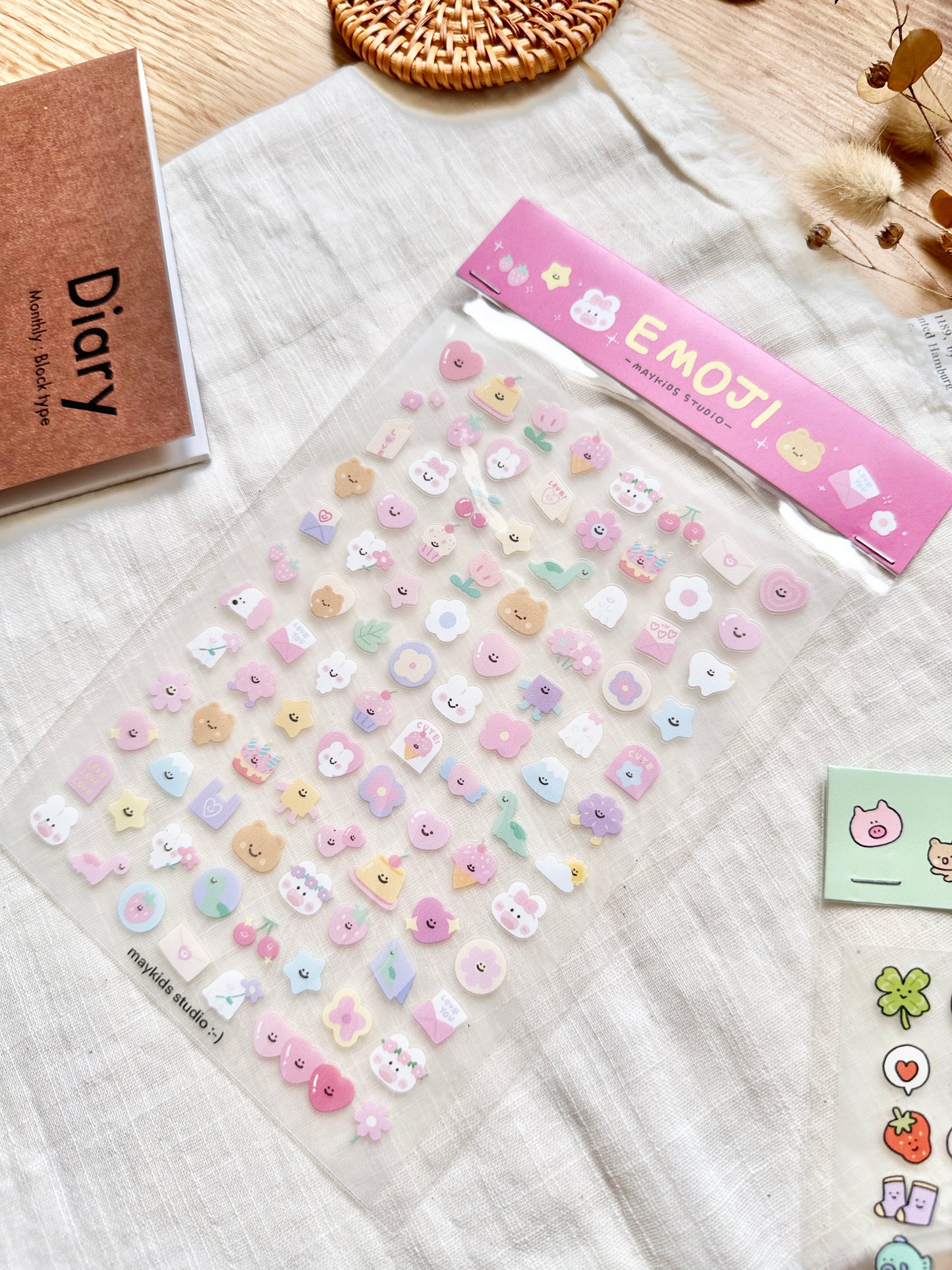 Sheet of colorful stickers with 'MAYKIDS STUDIO' branding on a textured surface. cute, sticker, hope and letters, nz, auckland, pink