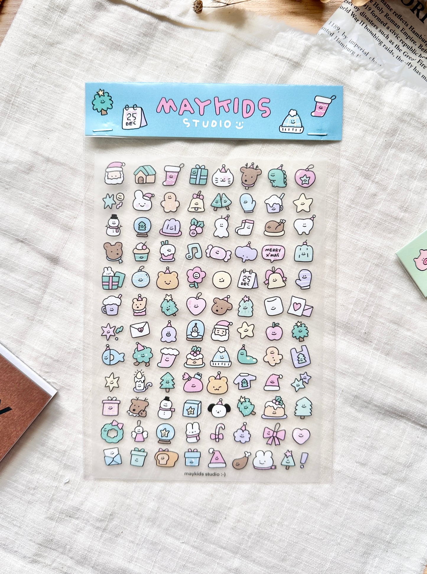 Sheet of colorful christmas-themed stickers with 'Maykids Studio' branding. cute, stickers, christmas, pastel, hope and letters, nz, stationery