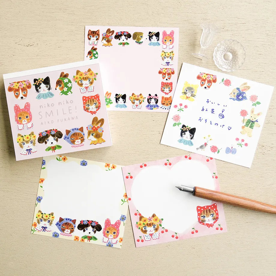 Card with illustrations of animals wearing colorful headbands on a light wooden surface, cat, rabbit, cute, japan, block memo, memopad, notepad, thick paper, smooth, aiko fukawa, nz, hope and letters, new zealand