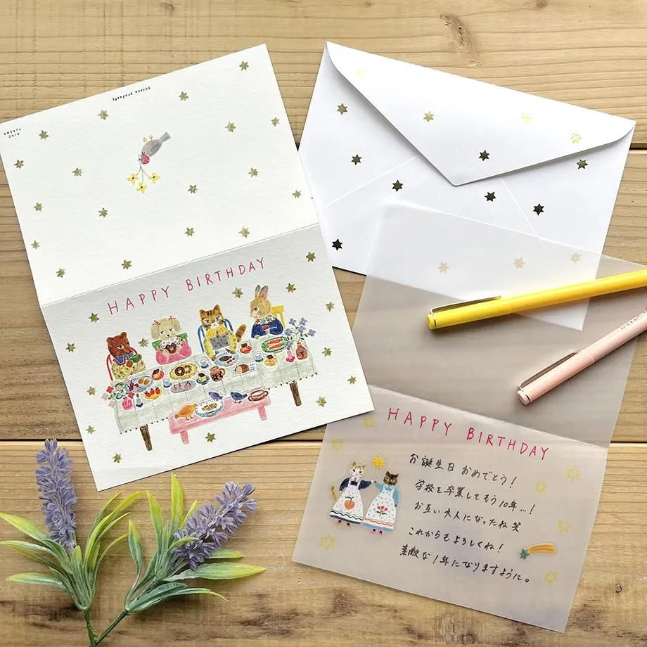 Birthday card with cat illustrations on a table with a pen and flowers. cute, birthday card, cat, flowers, floral, nz, hope and letters, nz, auckland, new zealand, stationery,