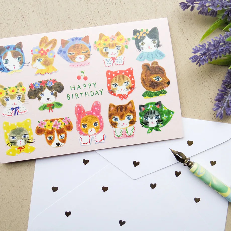 Birthday card with cat illustrations on a table with a pen and flowers. cute, birthday card, cat, flowers, floral, nz, hope and letters, nz, auckland, new zealand, stationery,