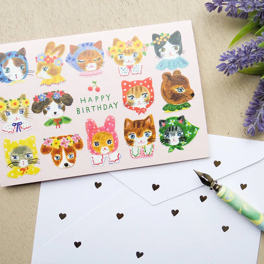 Birthday card with cat illustrations on a table with a pen and flowers. cute, birthday card, cat, flowers, floral, nz, hope and letters, nz, auckland, new zealand, stationery,