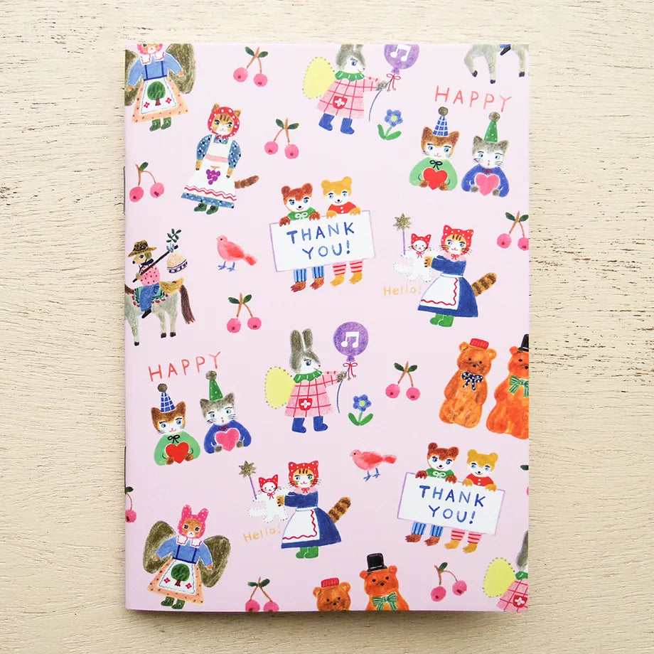 Notebook with colorful animal illustrations and 'Thank you!' text on a light wooden surface, cat, aiko fukawa, rabbit, pink, flower, japan, hope and letters, nz, notepad, notebook, blank
