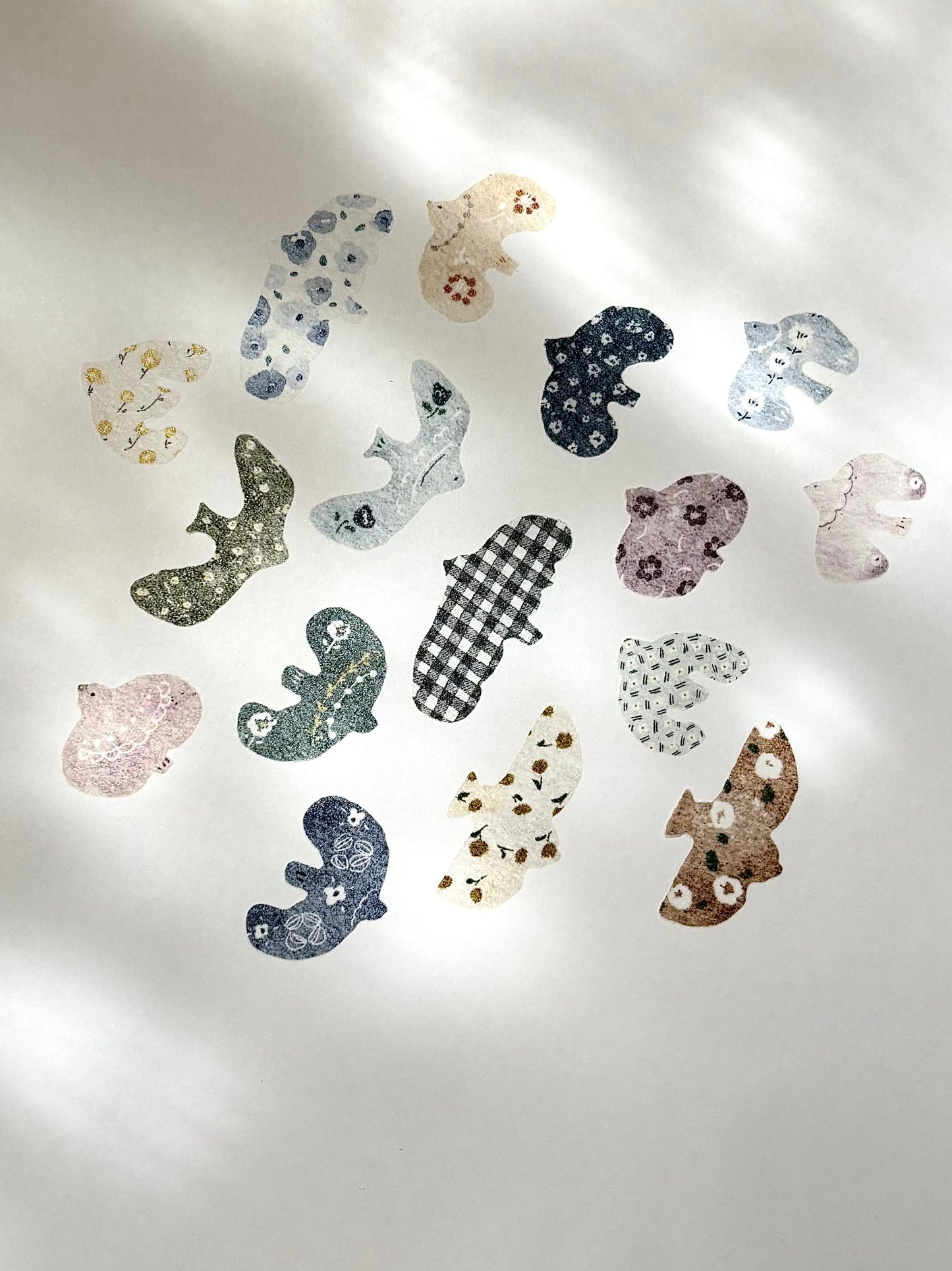 Decorative animal-shaped wall stickers on a light gray wall. washi tape, pion, hope and letters, nz, taiwan, design, bird, floral, cute