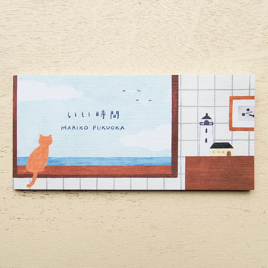 Notebook with a cat illustration and lighthouse on a tiled wall background, cute, cat, japan, nz, hope and letters, notebook, memopad, washi paper, cozy