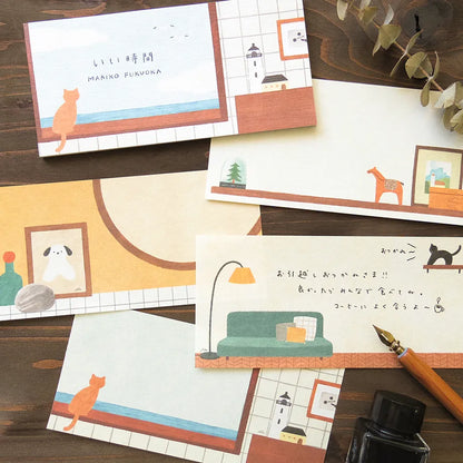 Notebook with a cat illustration and lighthouse on a tiled wall background, cute, cat, japan, nz, hope and letters, notebook, memopad, washi paper, cozy