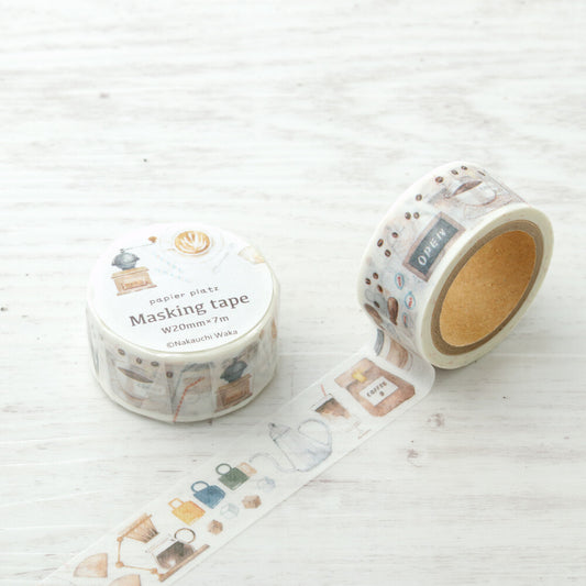 Two rolls of decorative masking tape with patterned designs on a light wooden surface. coffee, washi tape, japan, nz, cute
