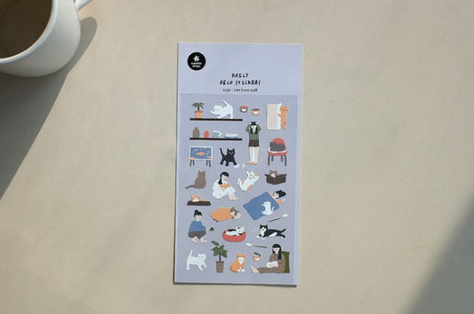 A sheet of cute daily help stickers with various illustrated characters and objects, displayed on a light beige surface next to a white mug. suatelier, daily deco, stickers, hope and letters, korea, nz, new zealand, cat, cute